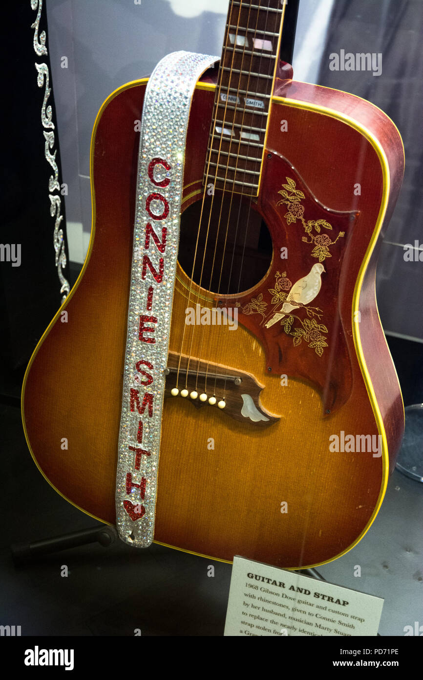 An acoustic guitar with a rhinestone strap belonging to singer Connie Smith at the Country Music Hall of Fame, Nashville, Tennessee, USA Stock Photo