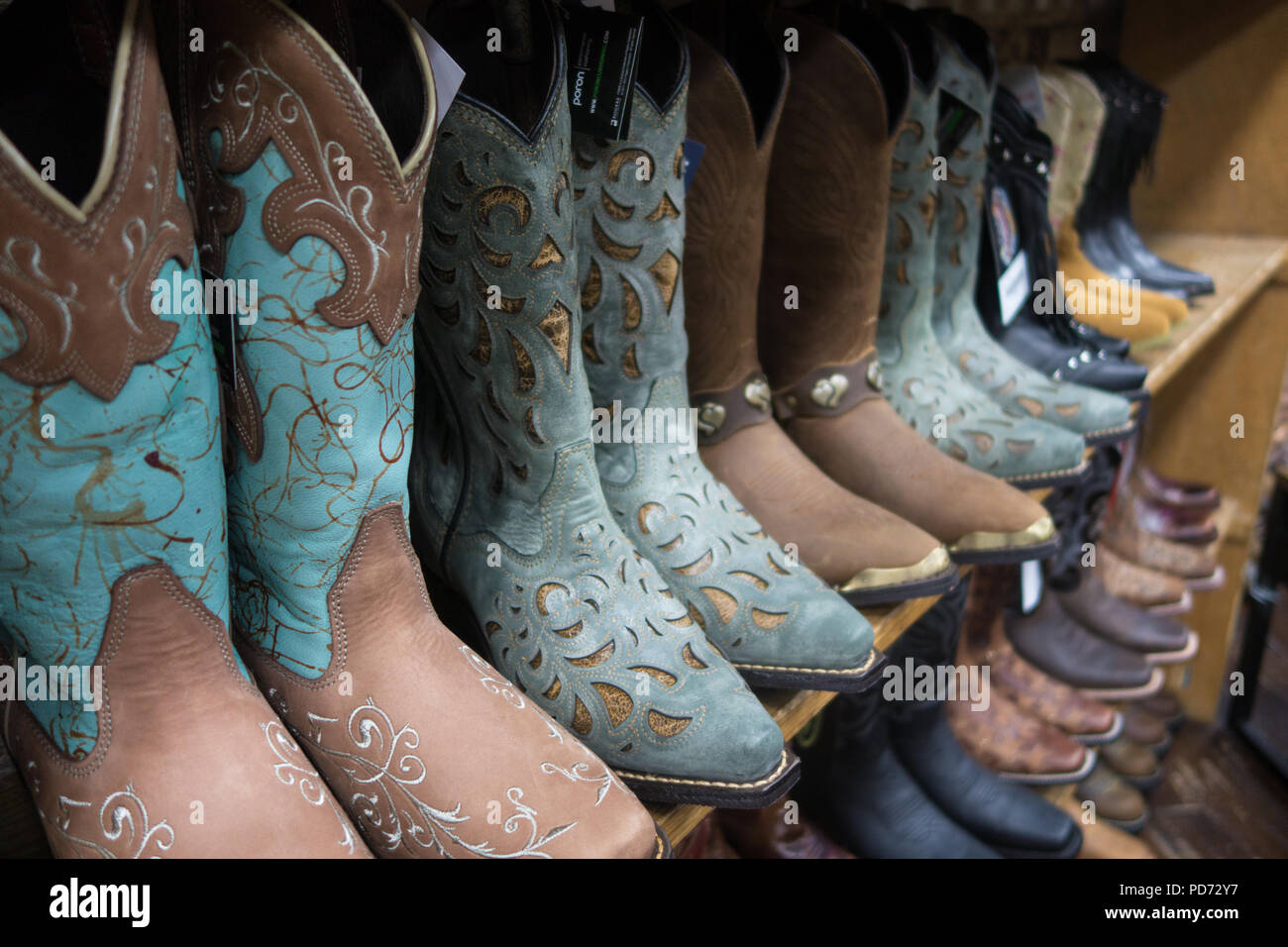 Rows of cowboy boots for sale in a boot shop in Nashville, TN, USA Stock Photo