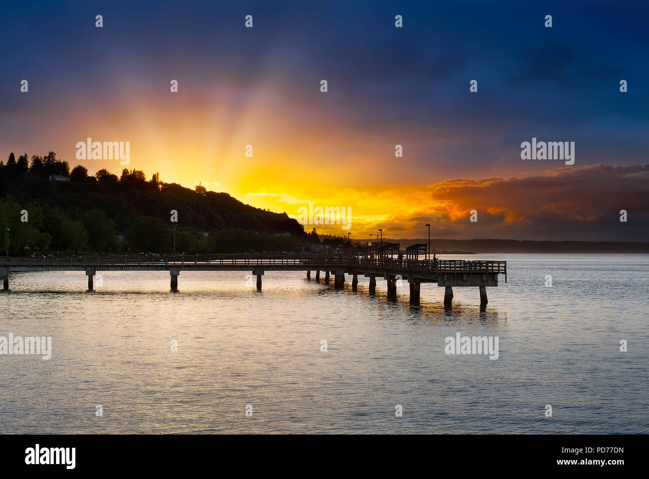 Sunset along Ruston Way by fishing pier on Commencement Bayin Tacoma Washington Stock Photo