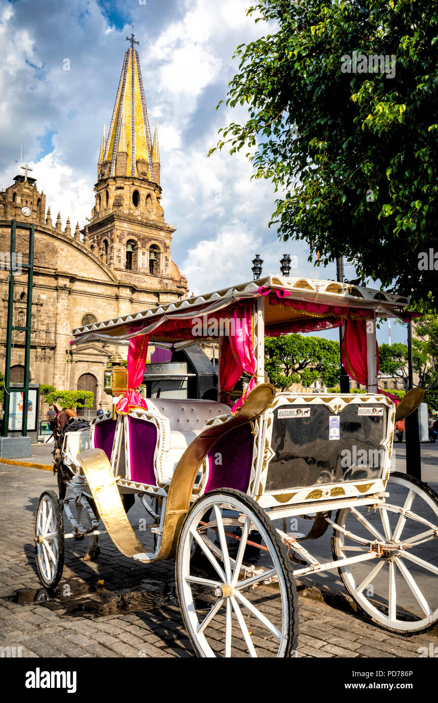 Horse drawn carriages wait for tourists in downtown Guadalajara, Jalisco, Mexico. Stock Photo