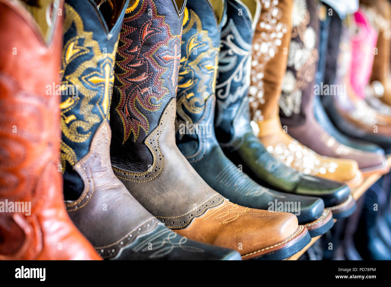 A variety of cowboy boots in the San Juan de Dios market of Guadalajara, Jalisco, Mexico. Stock Photo