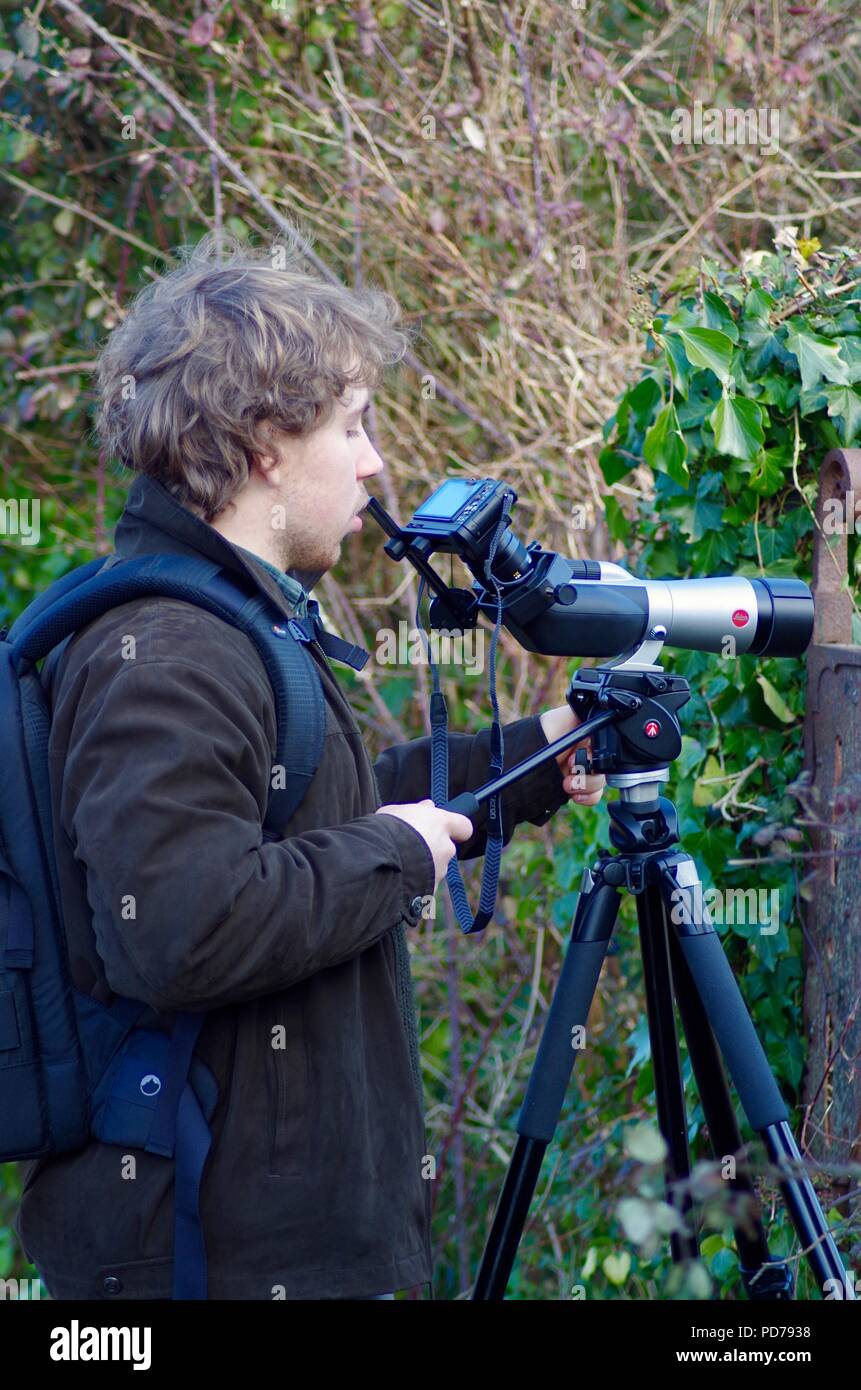 Caucasian British Teenaged Birdwatching, Photographing Wildlife on Bowling Green Marsh Through a