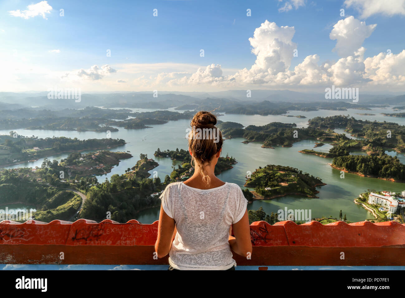 Looking out at the beautiful Island view of the Guatape region after a long hike to the top of the viewpoint Stock Photo