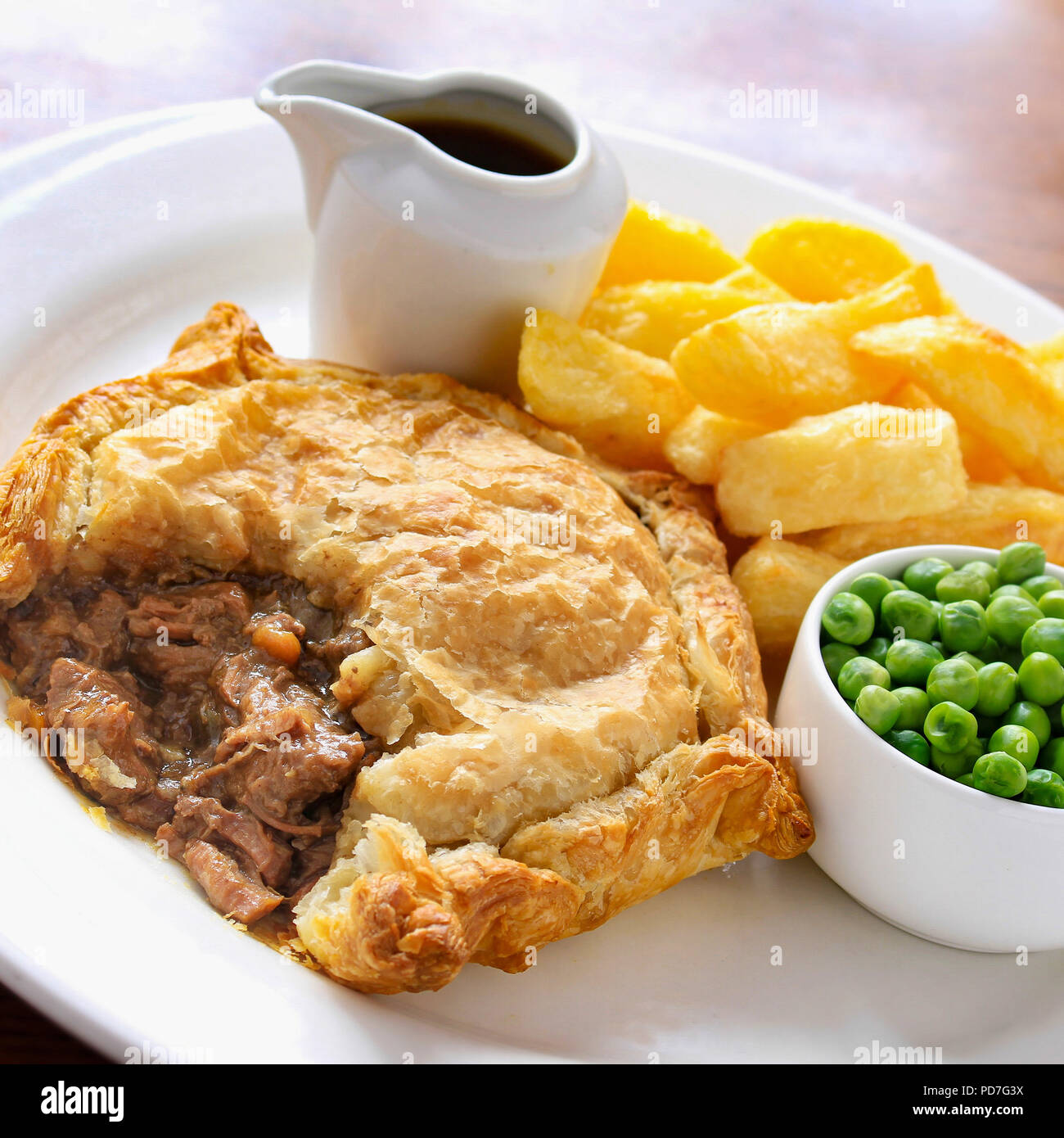 plated steak pie and chips dinner Stock Photo - Alamy