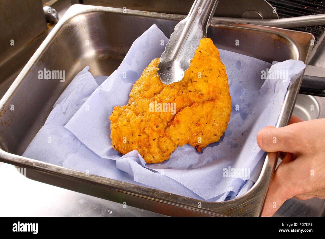 frying breaded chicken escalope Stock Photo Alamy