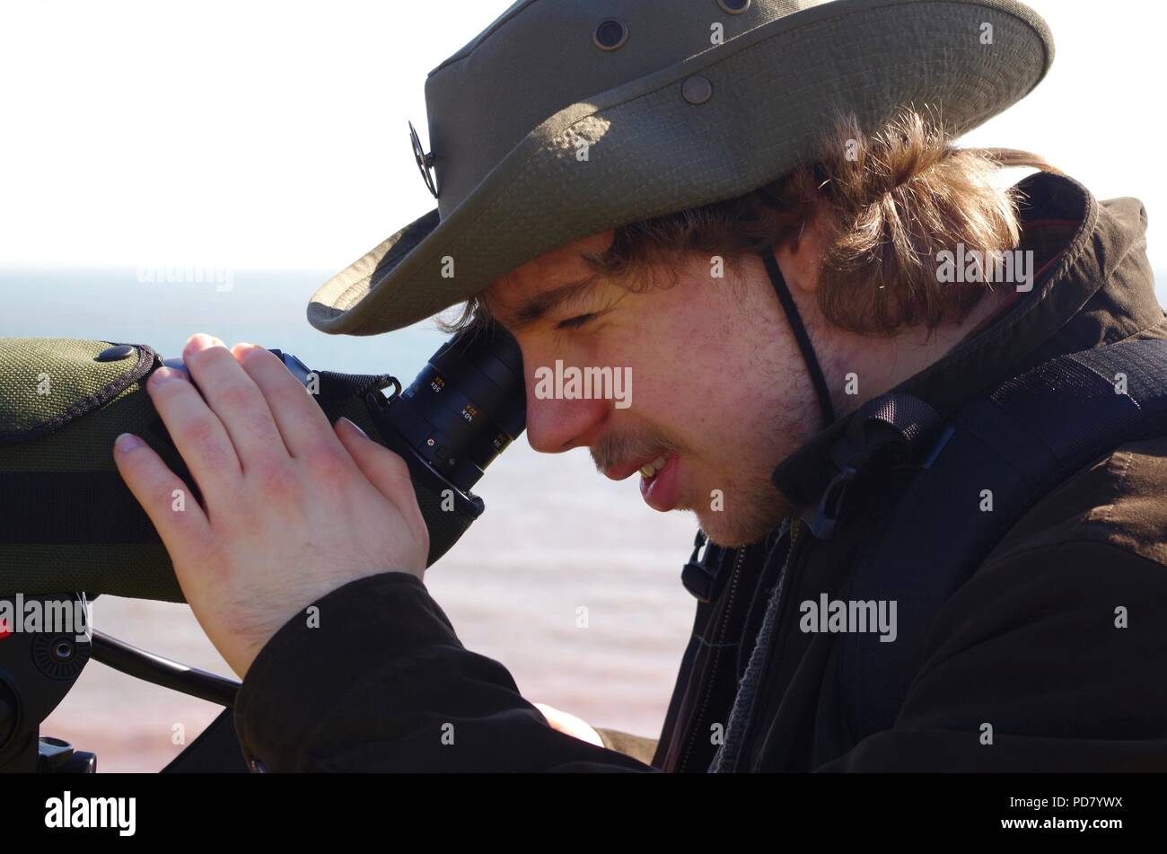 British Birdwatcher with Leica Spotting Scope Birdwatching at Budleigh