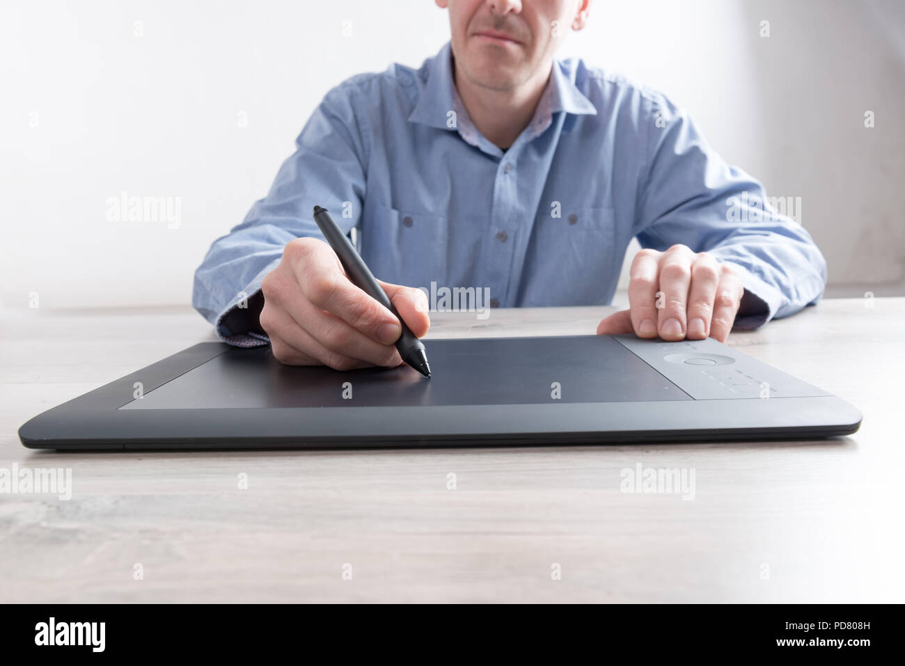 Man using modern graphical tablet Stock Photo