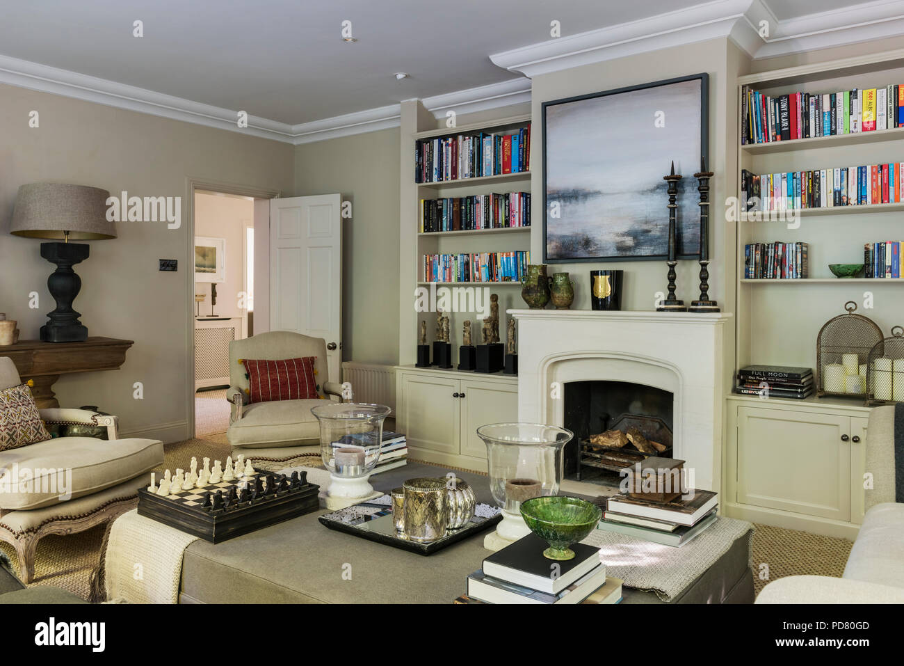 Bespoke ottoman from Cassia Bardoe Interior Design in elegant sitting room Stock Photo