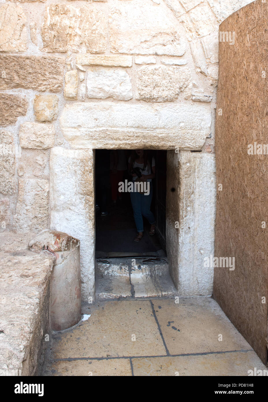 The Door of Humility, entrance to the Church of the Nativity, Bethlehem.  Made small by the Crusaders  to prevent people entering on horseback. Stock Photo