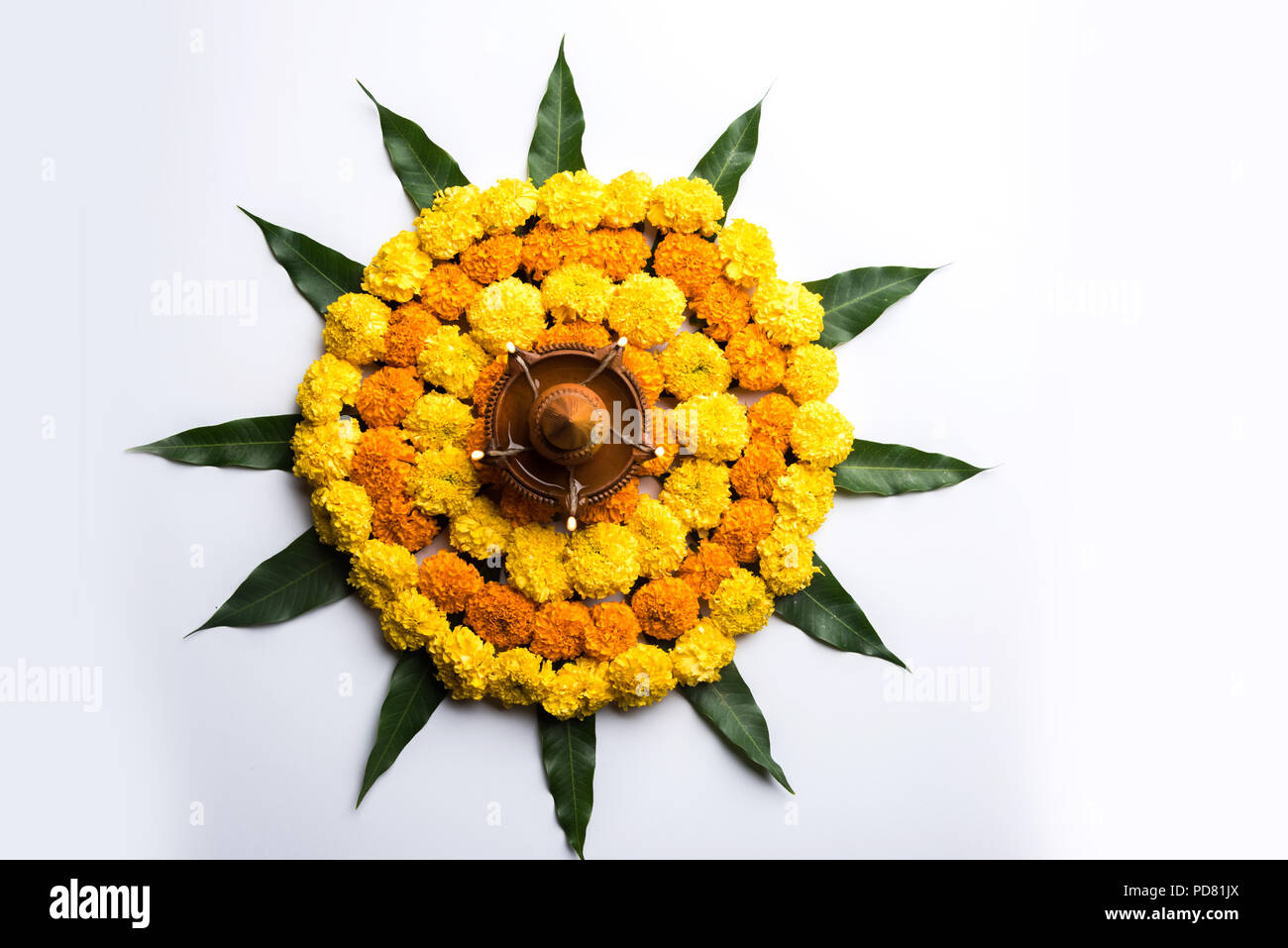 Flower Rangoli for Diwali or Pongal Festival made using Marigold or