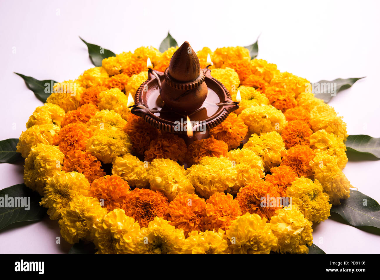 Flower Rangoli for Diwali or Pongal Festival made using Marigold or