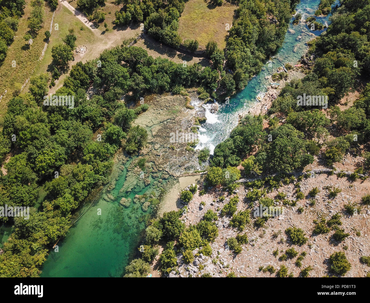 Zrmanja River in northern Dalmatia, Croatia is famous for its crystal clear waters and countless waterfalls surrounded by a deep canyon. Stock Photo