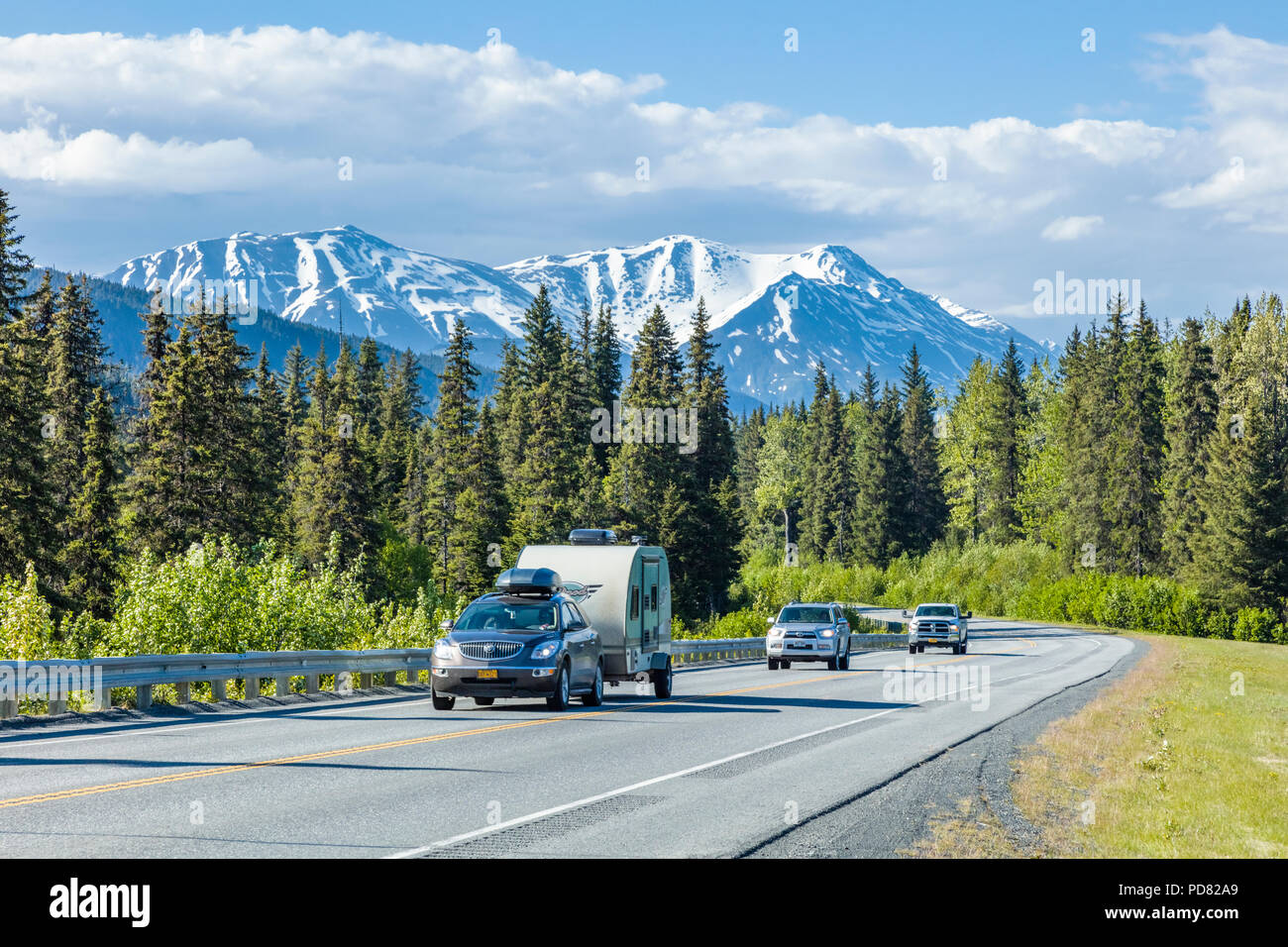 Vehicles on the Seward Highway between Anchorage and Seward on the Kenai Peninsula in Alaska Stock Photo