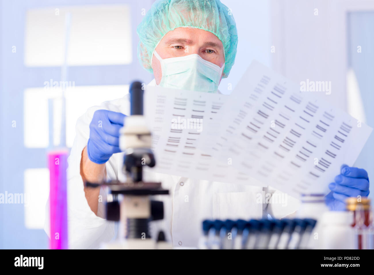 Scientist analizing DNA sequence Stock Photo