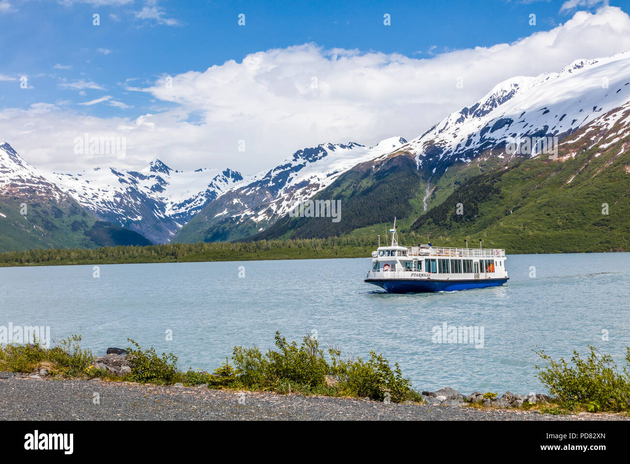 Glacier tour boat mv Ptarmigan on Portage Lake which  is a glacial lake in the Chugach National Forest on the Kenai Peninsula of Alaska Stock Photo