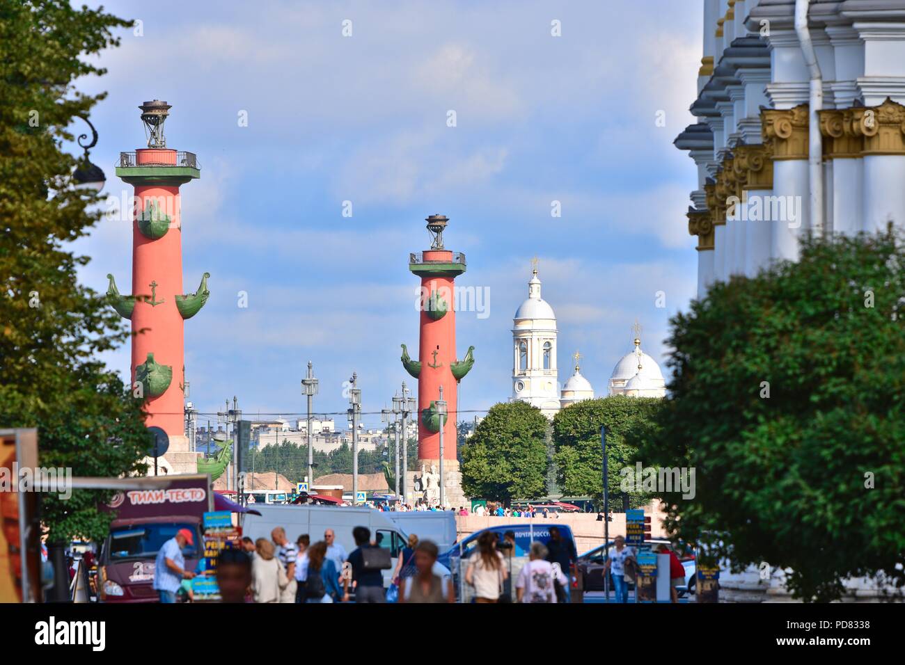 Rostral columns and The Prince St. Vladimir's Cathedral as seen from Winter palace's garden Stock Photo