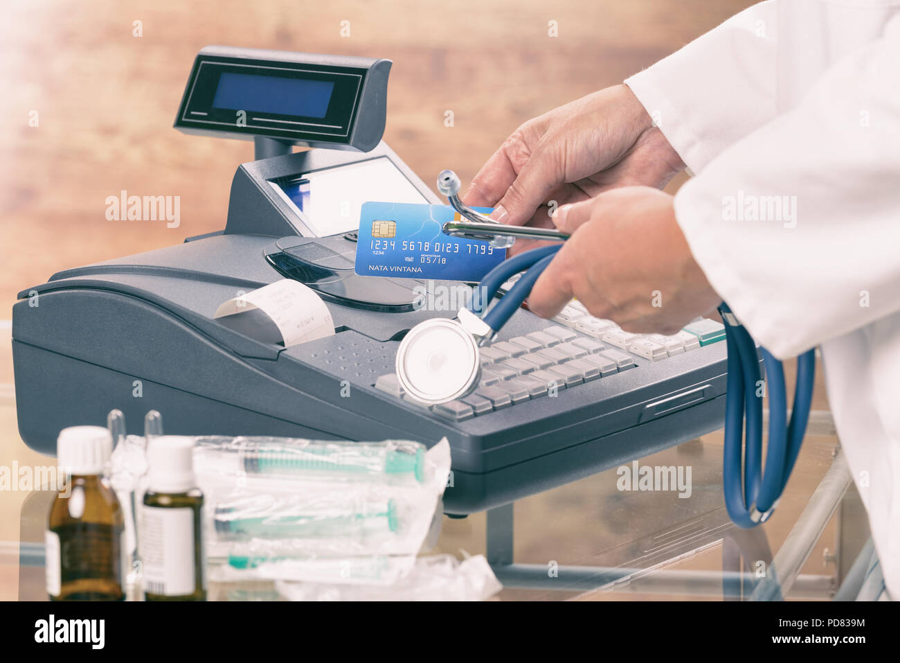 pharmacist or medical doctor holdnig stethoscope and using cash