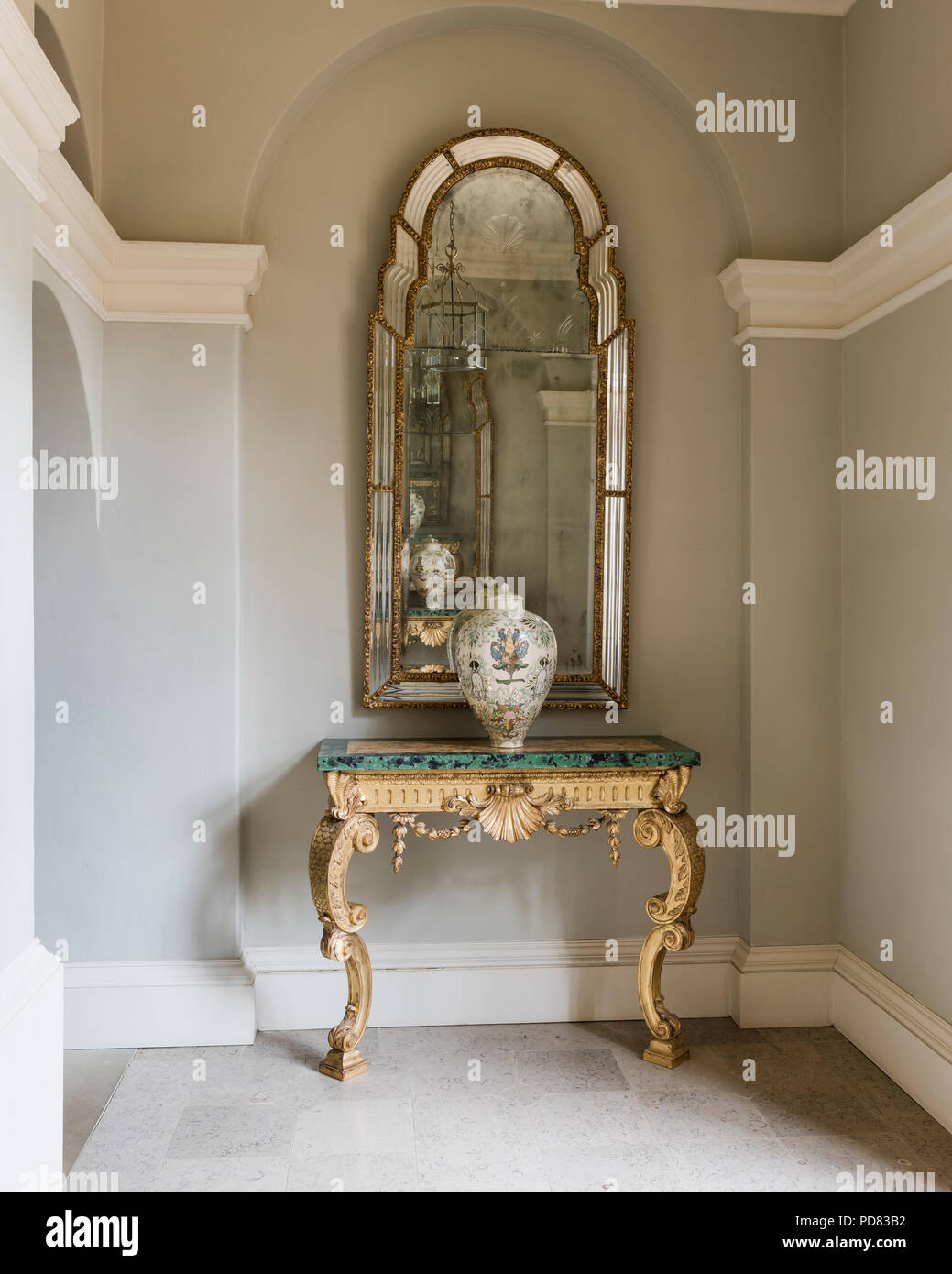 Antique French Gilt Wood and Marble Console Table under gilt framed mirror Stock Photo