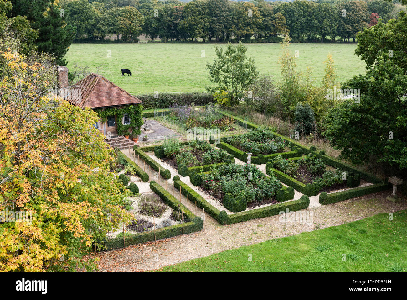 Small potting shed within the parterre garden and box hedge Stock Photo