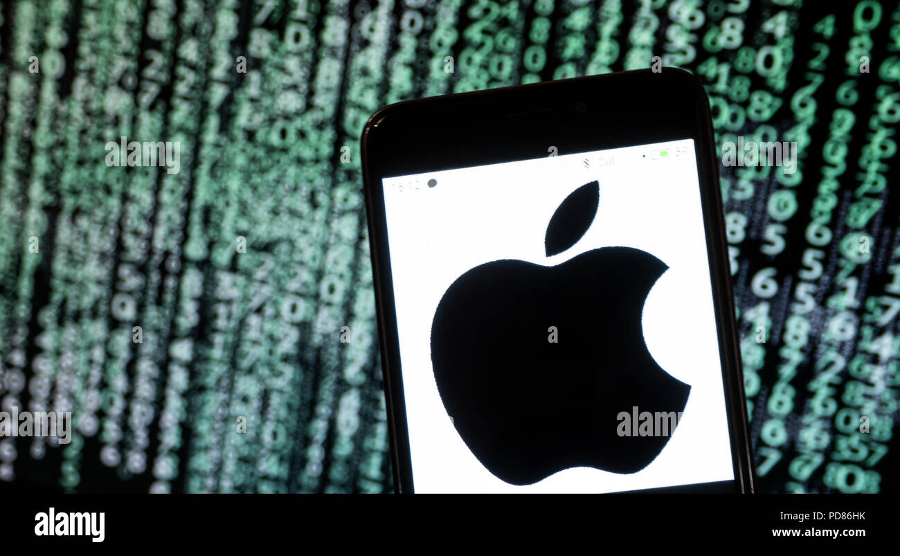 KIEV, UKRAINE - Aug. 5, 2018: The Apple logo seen displayed on a smart phone with a digital background. Apple's capitalization exceeded $1 trillion Stock Photo