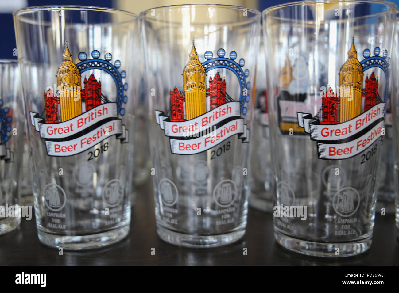London UK 07 August 2018 The Great British Beer Festival one of the biggest, most exciting and well-known events in the beer and cider world. Organised by the Campaign for Real Ale ,CAMRA, is an independent, voluntary organisation which campaigns for real ale, cider and perry as well as protecting and promoting community pubs and clubs and fighting for consumer rights.Beer drinkers weren't disappointing to find  hundreds of real ales, international beers and real ciders and perries under the iconic Olympia roof Credit: Paul Quezada-Neiman/Alamy Live News Stock Photo