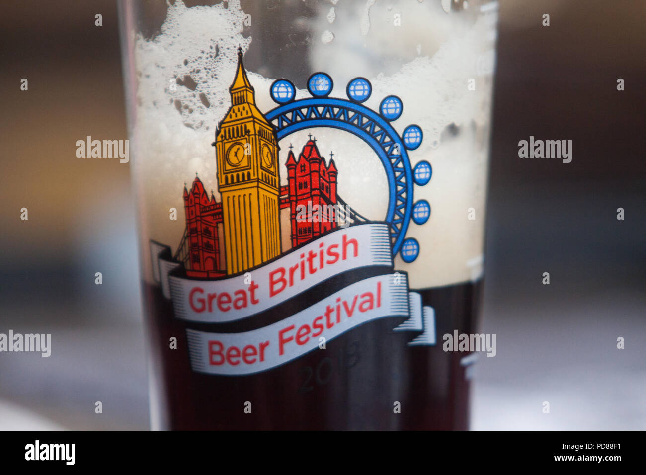 London UK. 7th August 2018. Visitors at the CAMRA (Campaign for Real Ale) Great British Beer Festival Britain's largest beer festival at Olympia exhibition centre. The five day event with around 55,000 people expected to attend and  features over 900 real ales and ciders from around the world. Credit: amer ghazzal/Alamy Live News Stock Photo