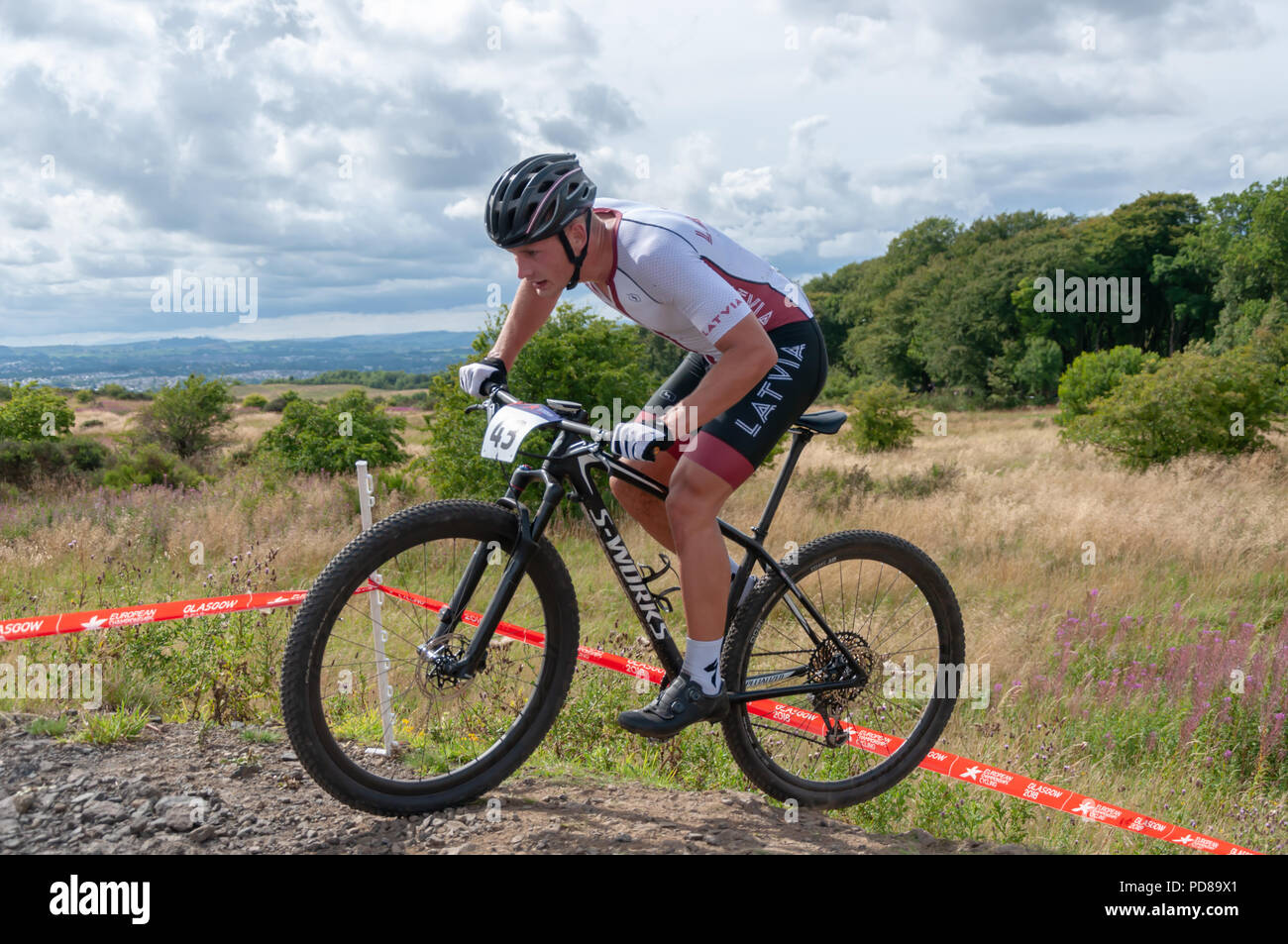 Glasgow, Scotland, UK. 7th August, 2018. Arnis Petersons of Latvia rides in  the Men's Mountain Bike Cross-Country at Cathkin Braes Mountain Bike Trails  on Day Six of the European Championships Glasgow 2018.
