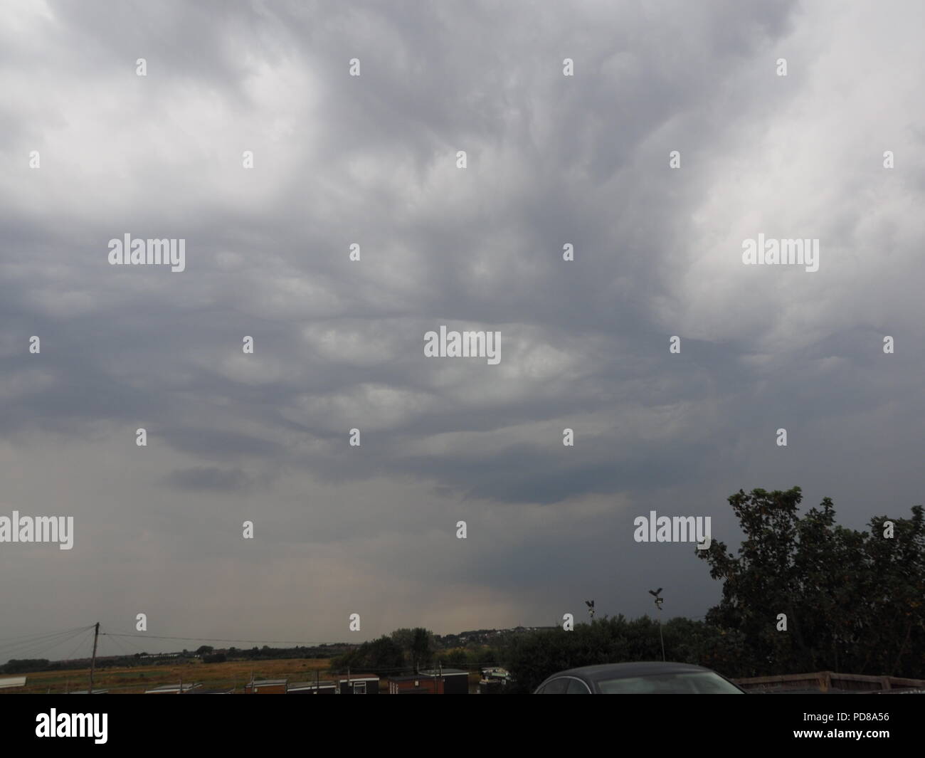 Sheerness, Kent, UK. 7th Aug, 2018. UK Weather: dark storm clouds build over Sheerness, Kent with several lightning strikes already seen. Credit: James Bell/Alamy Live News Stock Photo
