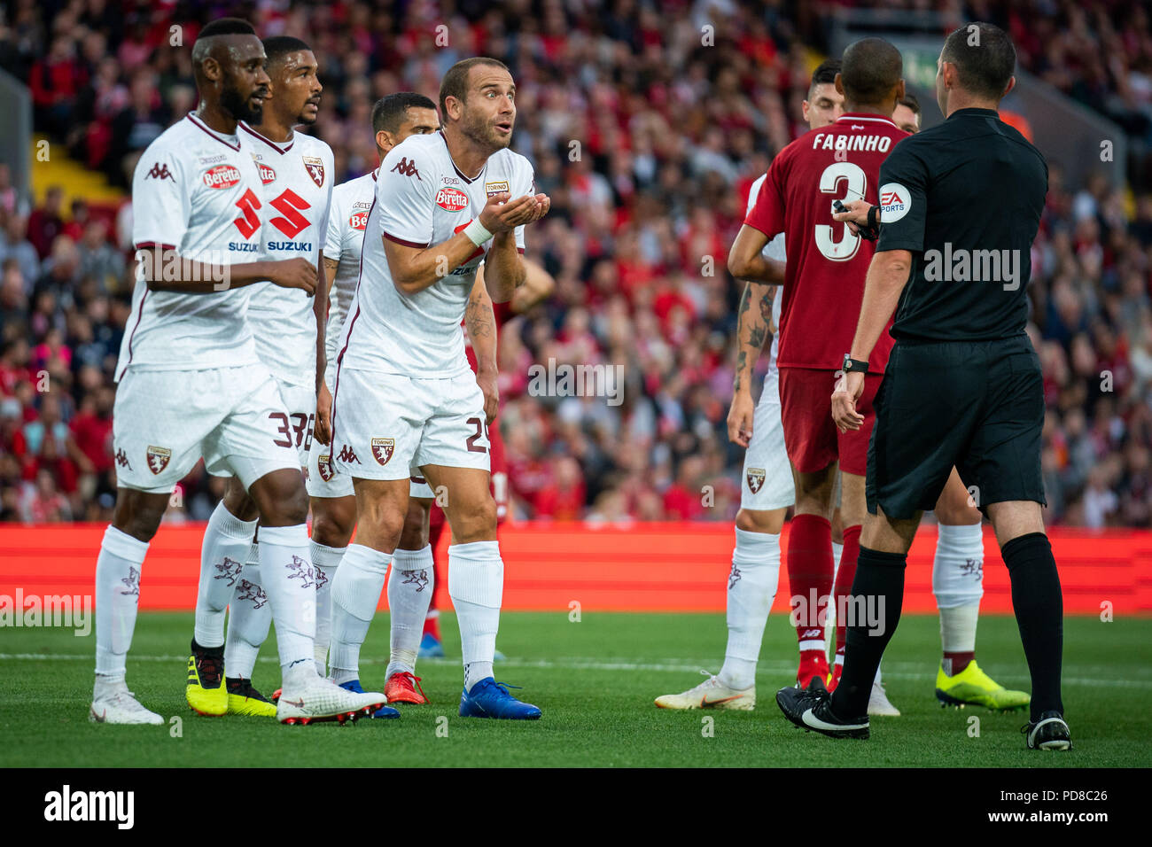 Liverpool, UK. 7th August 2018. Torino's Lorenzo De Silvestri remonstrates  with referee Michael Oliver 7h August