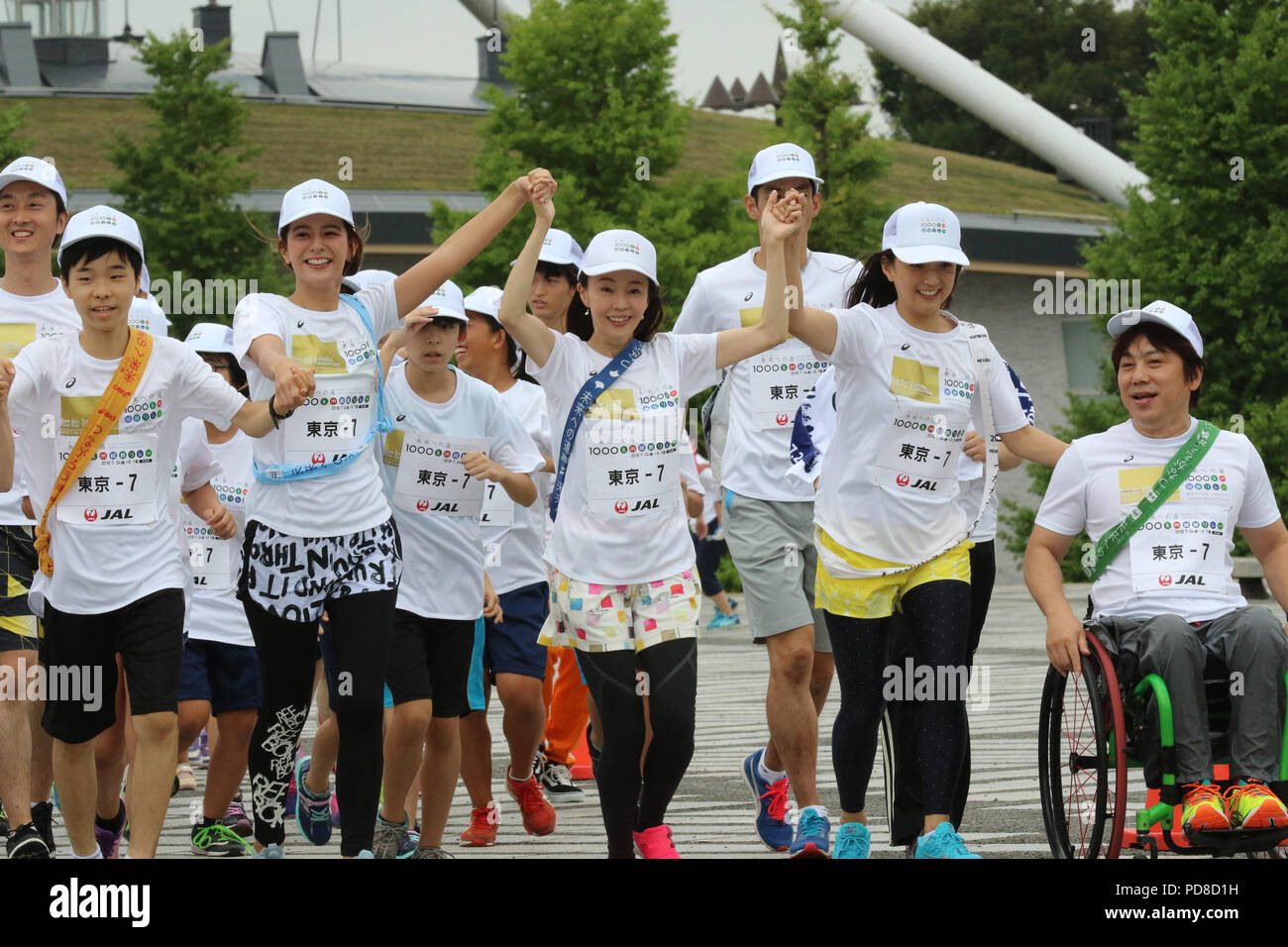 Tokyo, Japan. 7th Aug, 2018. (R-L) Japanese wheelchair basketball player Shinji Negi, Barcelona Olympics swimming gold medalist Kyoko Iwasaki, marathon runner Masako Chiba and TV personality Suzanne are on the way to finish line for the '1,000km relay to Tokyo' at the Komazawa stadium in Tokyo on Tuesday, August 7, 2018. Some 1,600 runners participated the marathon relay from Aomori to Tokyo for the commemoration of the 3.11 East Japan Great Earthquake. Credit: Yoshio Tsunoda/AFLO/Alamy Live News Stock Photo