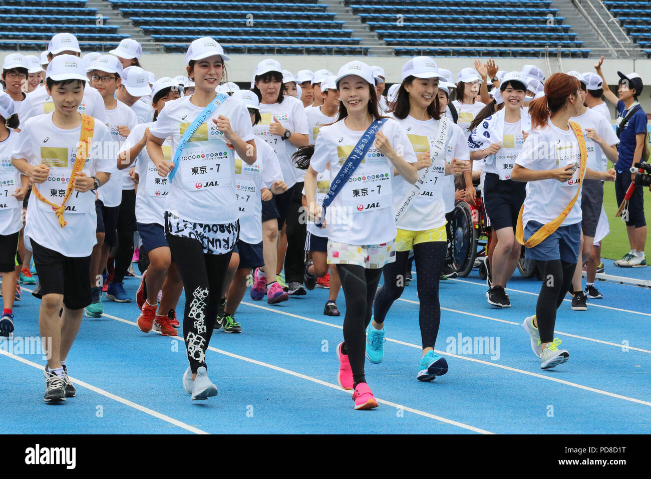 Tokyo, Japan. 7th Aug, 2018. (R-L) Japanese singer Dream Aya, Barcelona Olympics swimming gold medalist Kyoko Iwasaki, marathon runner Masako Chiba and TV personality Suzanne are on the way to finish line for the '1,000km relay to Tokyo' at the Komazawa stadium in Tokyo on Tuesday, August 7, 2018. Some 1,600 runners participated the marathon relay from Aomori to Tokyo for the commemoration of the 3.11 East Japan Great Earthquake. Credit: Yoshio Tsunoda/AFLO/Alamy Live News Stock Photo