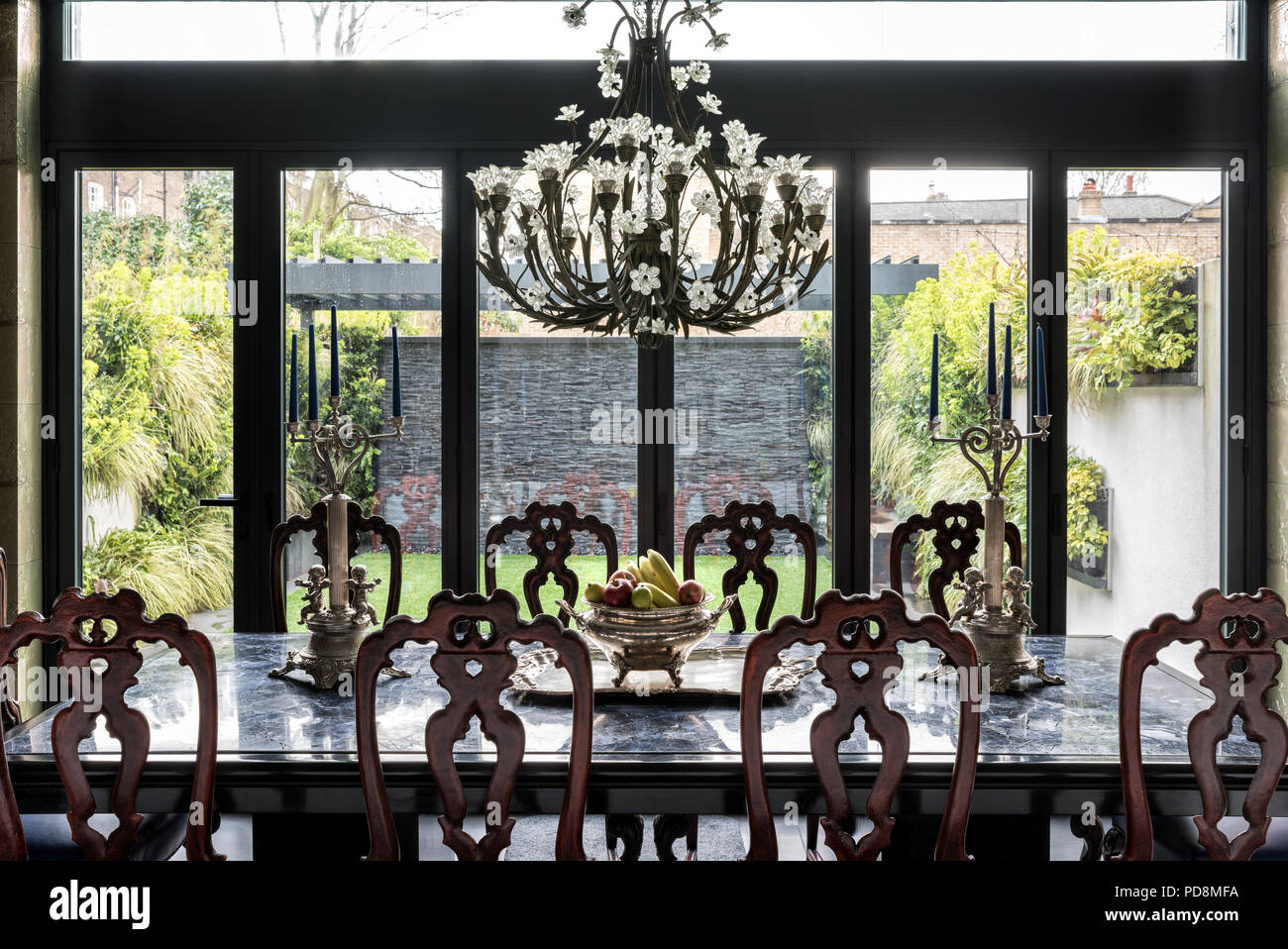 Lead crystal Baccarat chandelier above dining table in London home