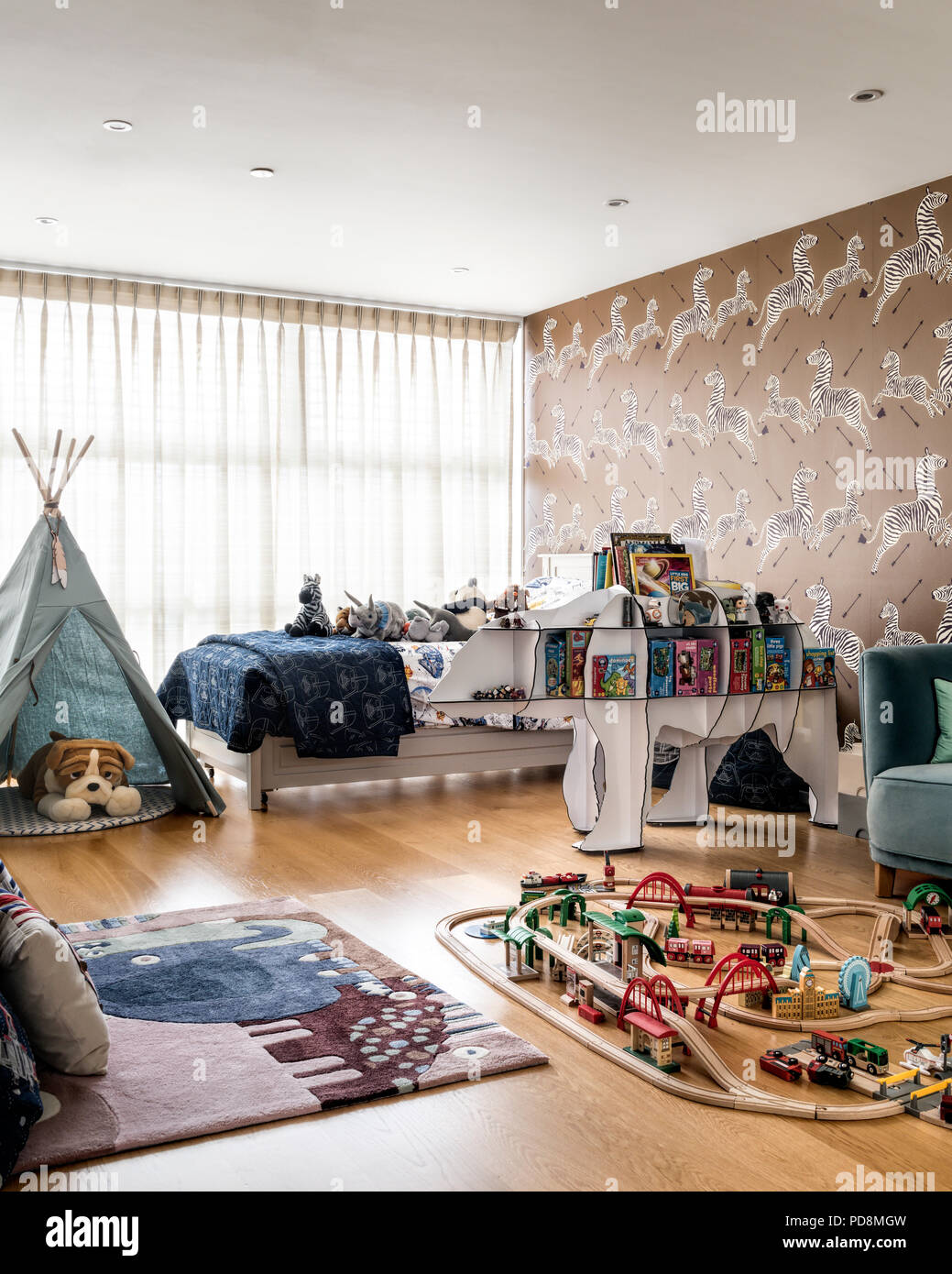 Boys room with wigwam and trainset Stock Photo