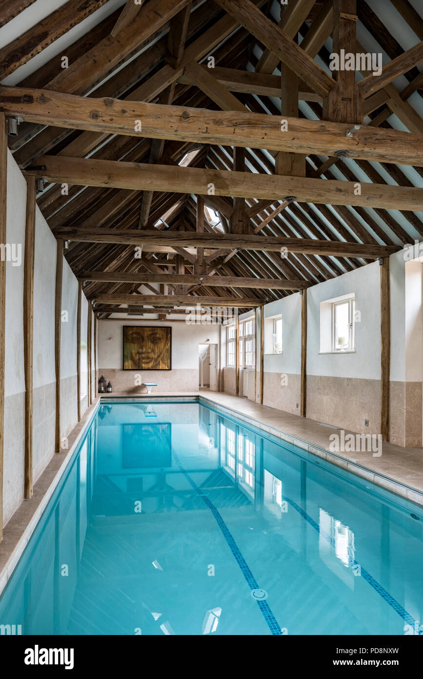 Luxury swimming pool in barn conversion Stock Photo