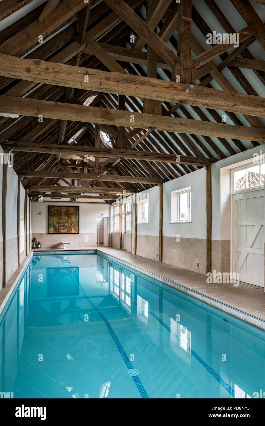 Luxury swimming pool in barn conversion Stock Photo - Alamy