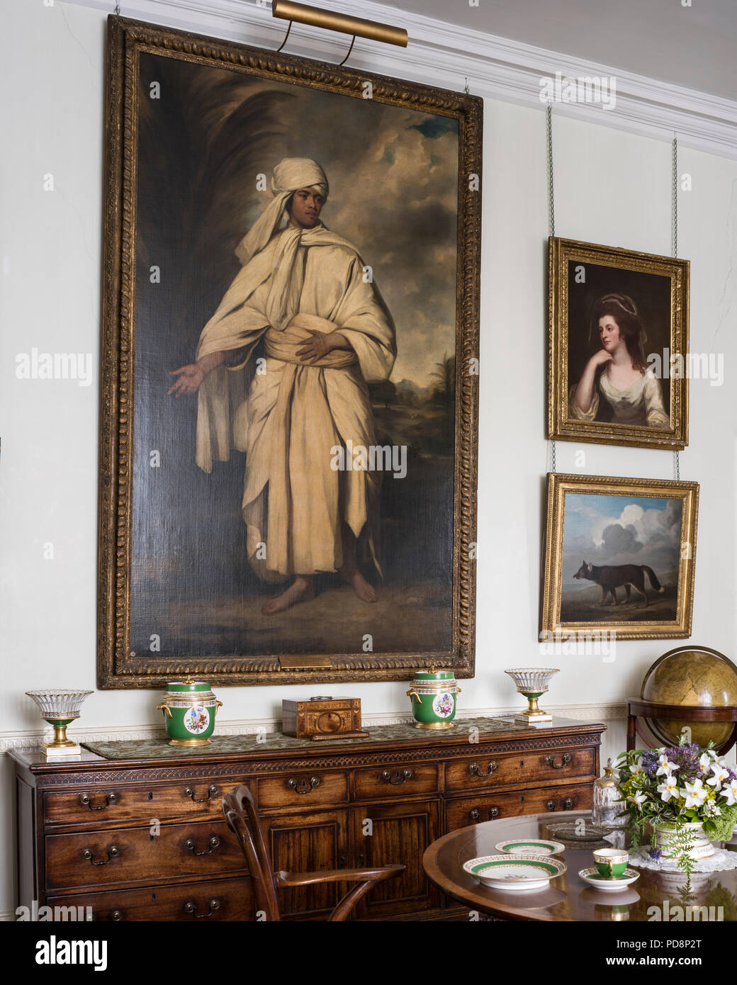 Large gilt framed artwork above sideboard Stock Photo