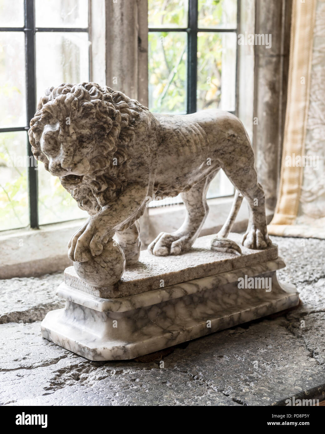 Marble statue of lion and orb Stock Photo