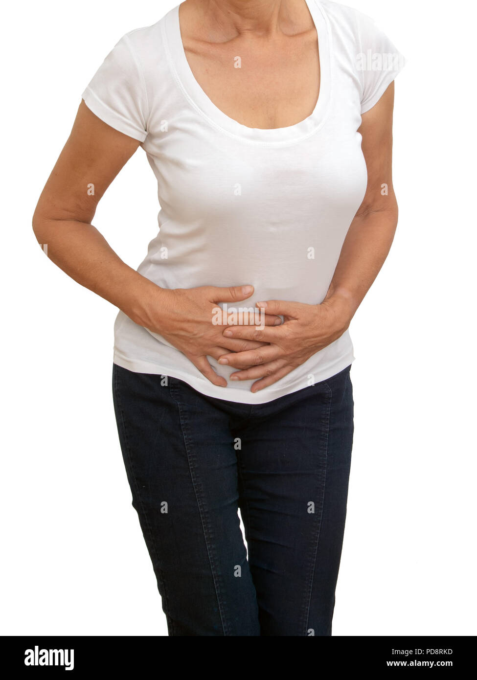 Unidentifiable older, mature woman with stomach pain, isolated on white background. Cramps, constipation etc. Stock Photo