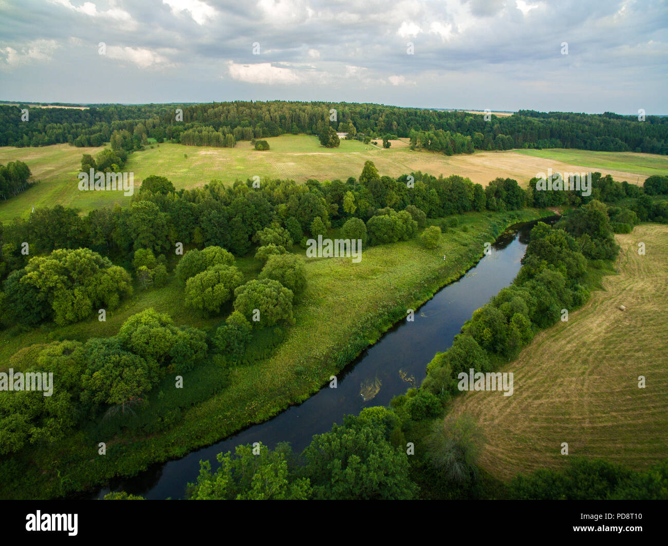 A beautiful view of the forest, fields and river from above. Drone photography of the nature Stock Photo