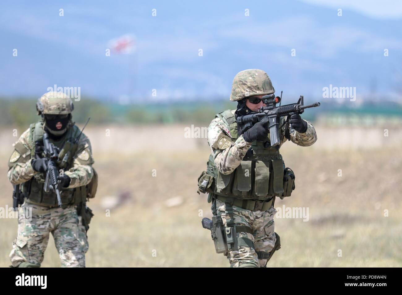 Georgian Armed Forces special forces move towards the objective after aerial insertion during an urban operations exercise at the Vaziani Training Area on Aug. 5, 2018 during Noble Partner 18, August 5, 2018. Georgia is hosting the multinational U.S. Army Europe exercise to promote stability in the region and support strengthening their defense and internal operations U.S Army photo by Staff Sgt. R. J. Lannom Jr. () Stock Photo
