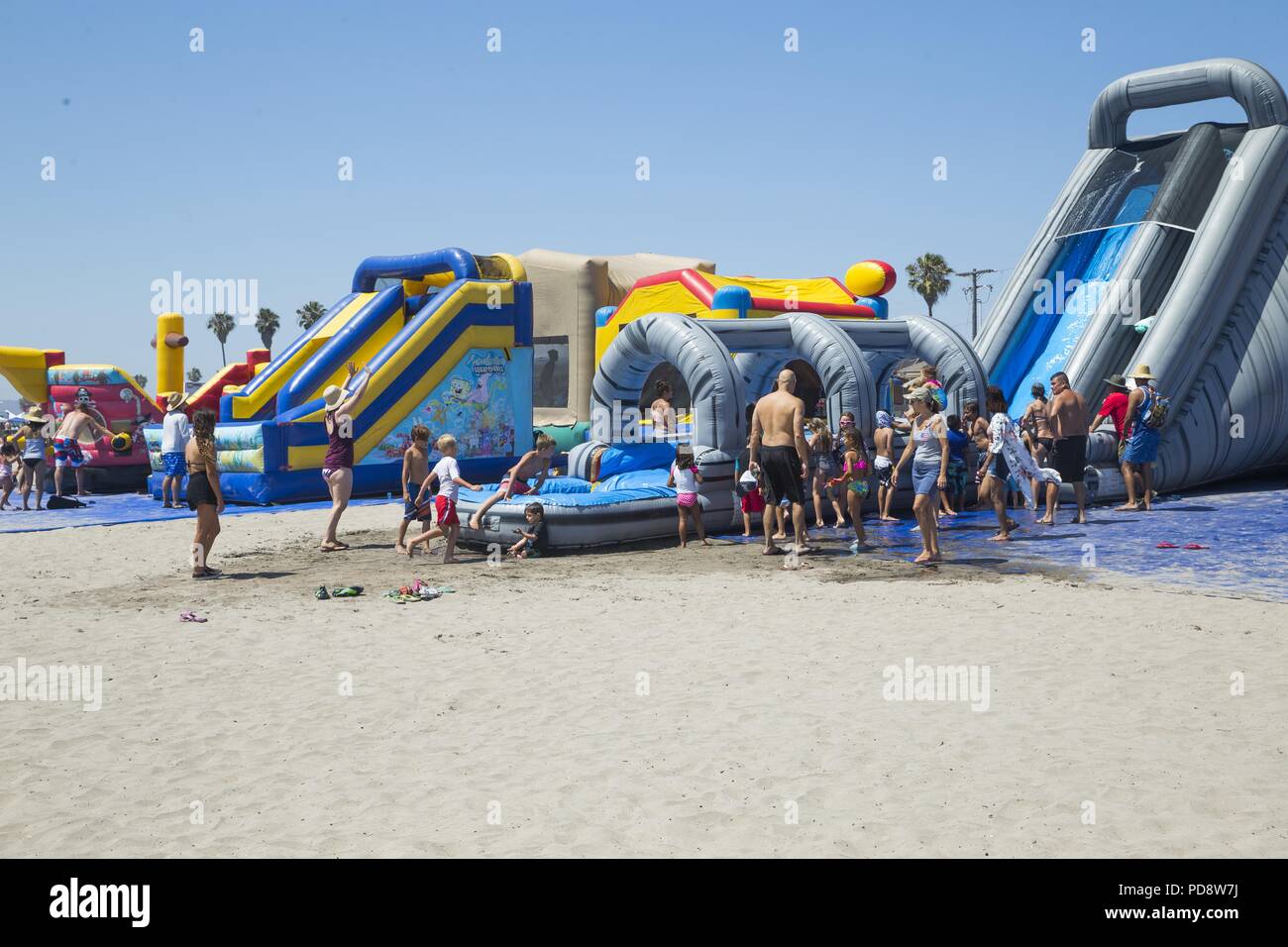 Families Participate In The Family Fun Zone Of The Fourth Of July Beach Bash At The