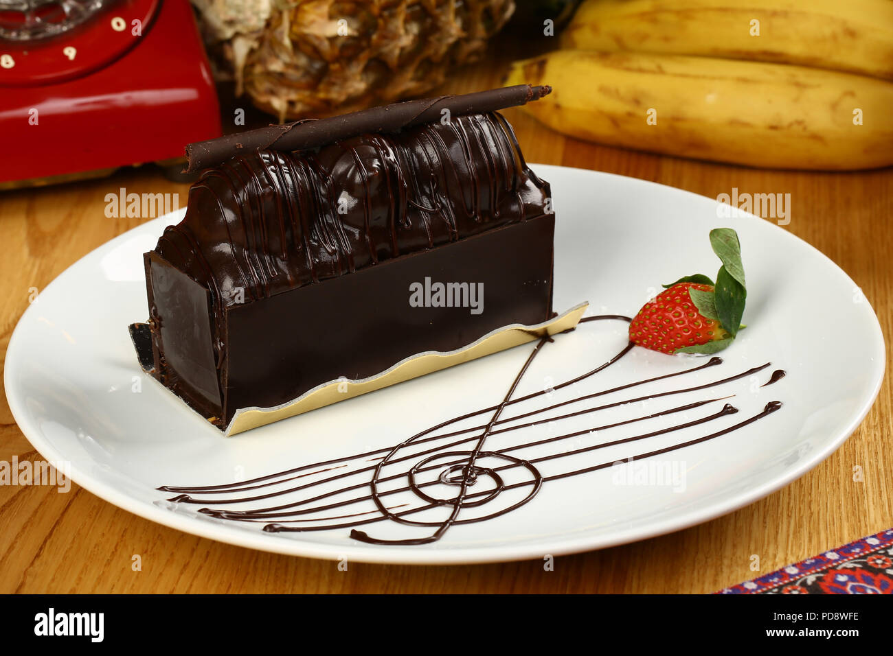 Malaga Dessert Chocolate Eclairs With Nuts And Banana Dessert Stock Photo Alamy