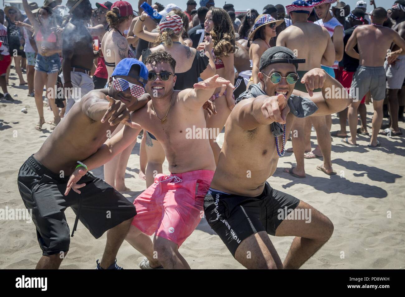 Attendees of the Fourth of July Beach Bash pose for a photo at the Del Mar Beach Resort on Marine Corps Base Camp Pendleton, California, July 4, 2018, July 4, 2018. Marine Corps Community Services (MCCS) hosted the event to provide Independence Day entertainment and recreational activities to service members and their families. (U.S. Marine Corps photo by Cpl. Dylan Chagnon). () Stock Photo