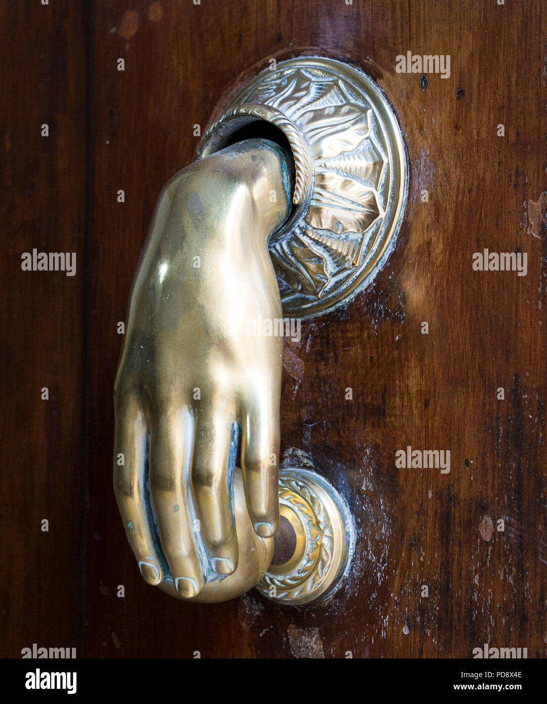 Brass hand door knocker hi-res stock photography and images - Alamy