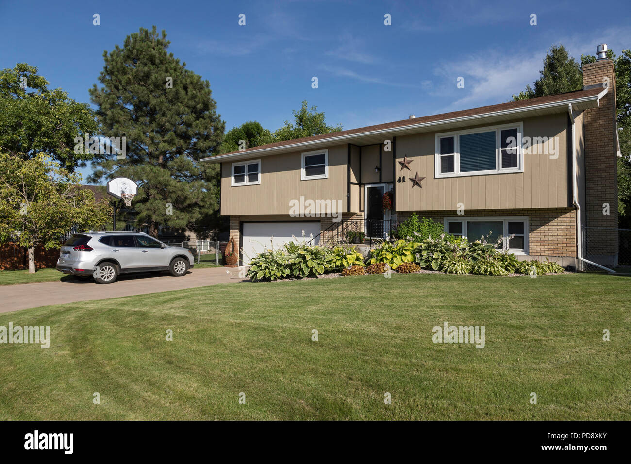 Residential House Exterior in Middle Class Neighborhood, MT, USA Stock