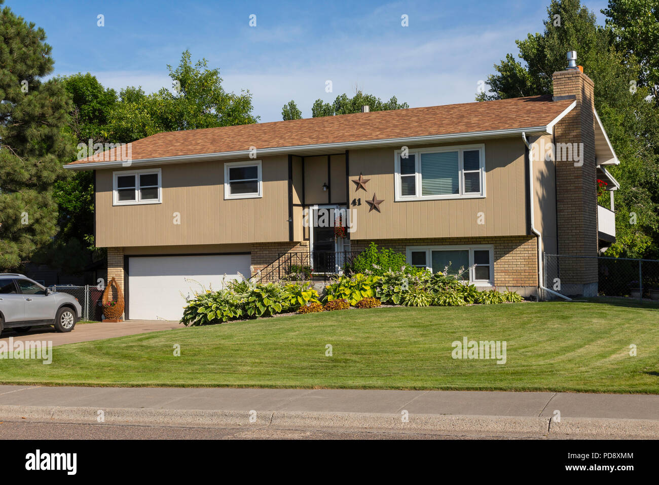 Residential House Exterior in Middle Class Neighborhood, MT, USA Stock