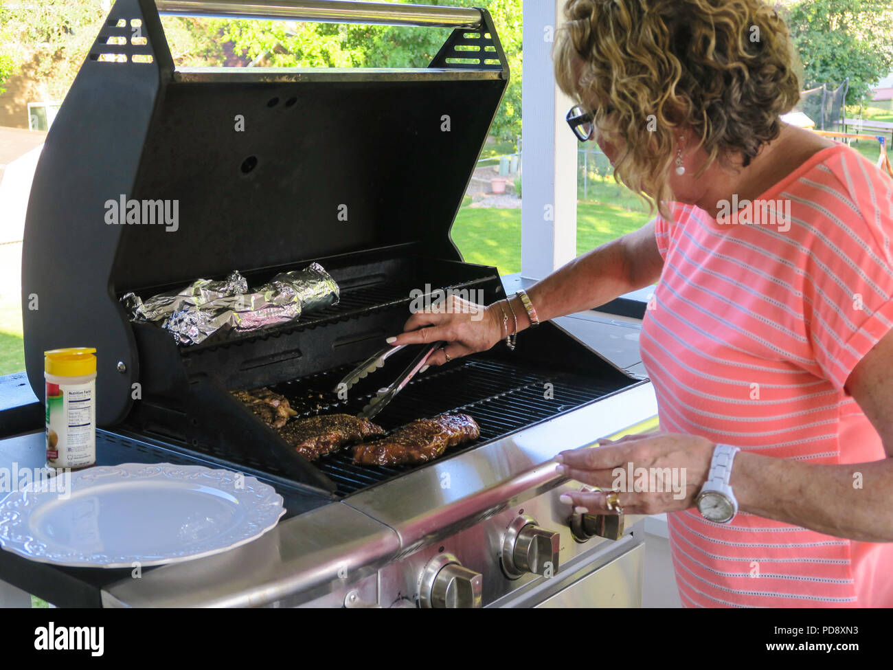 Grilling Steaks On The Patio Deck Usa Stock Photo 214711535 Alamy