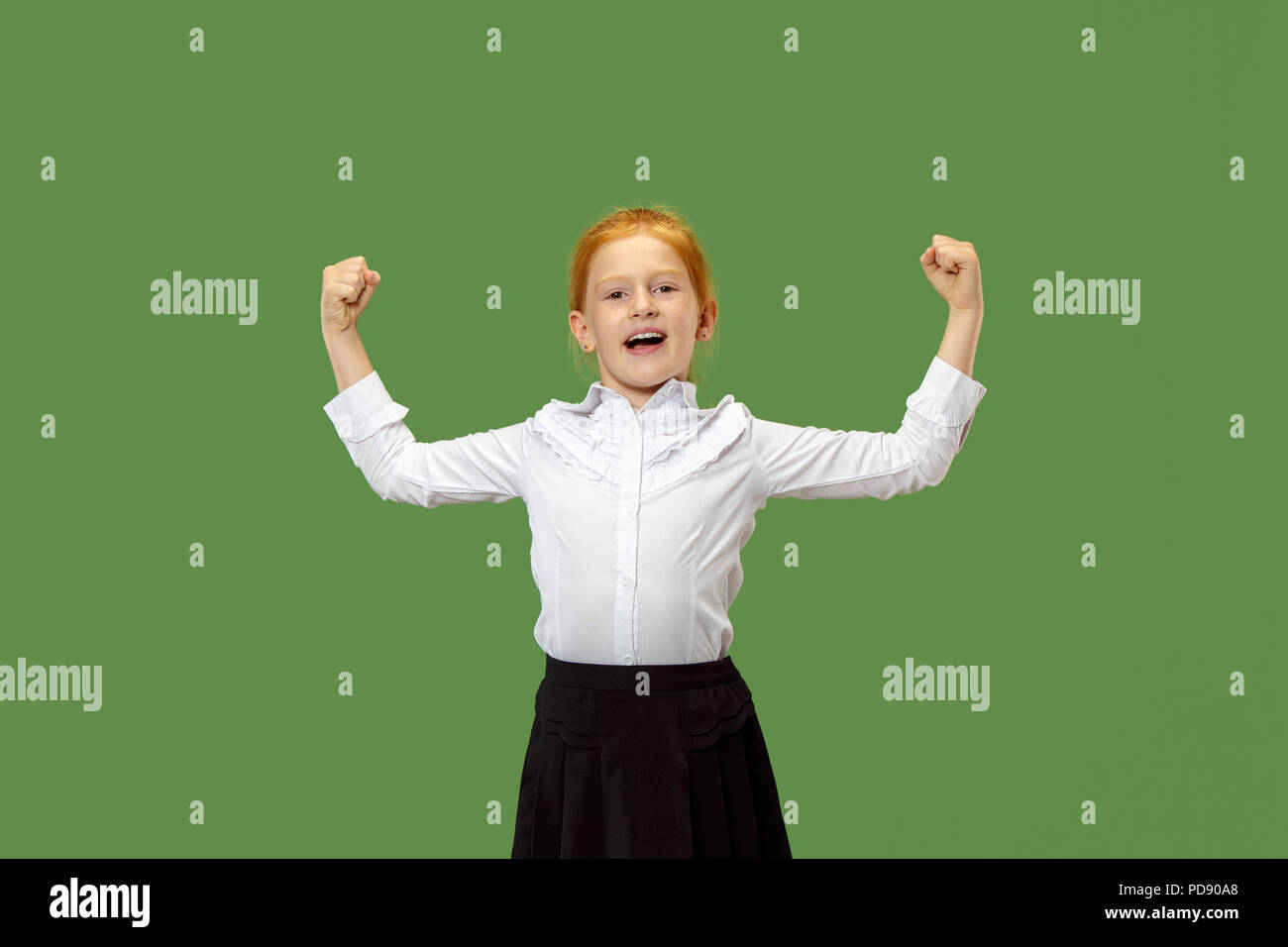 Happy teen girl standing, smiling and pointing to himself isolated on trendy green studio background. Beautiful female half-length portrait. Human emotions, facial expression concept. Stock Photo