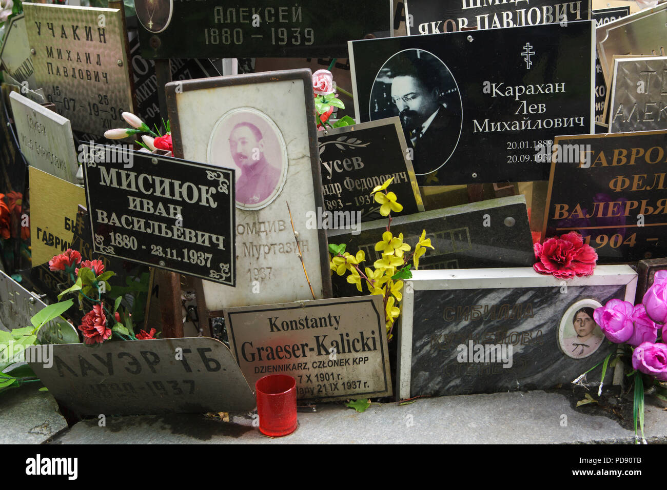 Communal grave of unclaimed ashes number one, where people executed by the NKVD were secretly buried from 1930 to 1942, at the Donskoye Cemetery in Moscow, Russia. It is believed the mass grave contains the remains of 4259 victims of Stalin's regime. The plaques with the names were installed by the relatives since the 1980s. The plaques devoted to Red Army commander Musa Murtazin and Russian revolutionary Lev Karakhan executed in 1937 are seen in the picture among others. Stock Photo