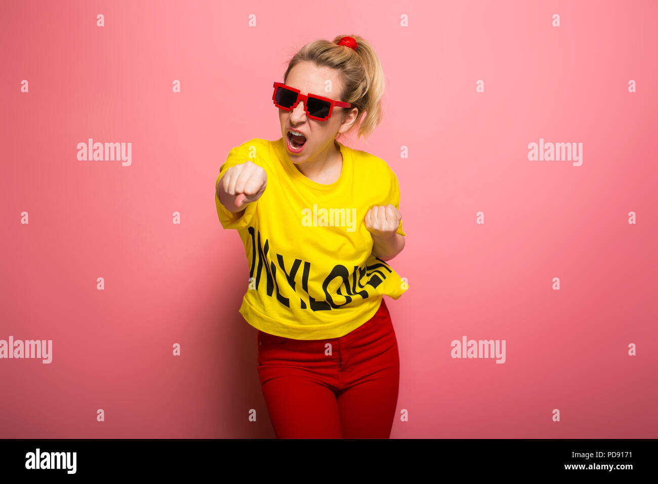 Blonde woman in bright clothes Stock Photo - Alamy